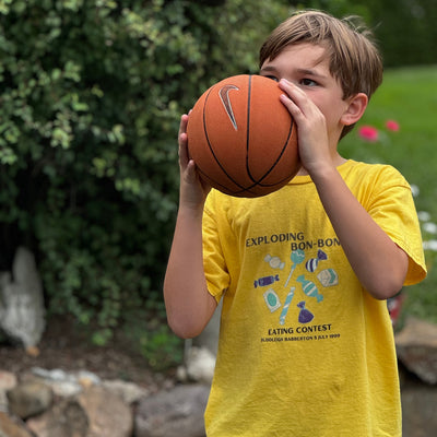 Youth_unisex_Exploding_Bon-Bon_Harry_Potter_Shirts_eating_contest_yellow_basketball_still