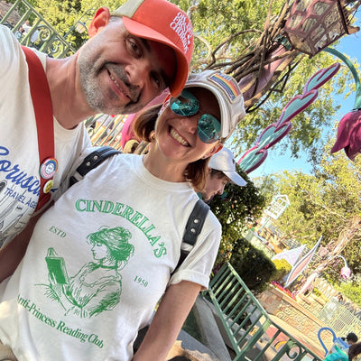 Woman wearing Cinderella Disney tee ivory with green graphic