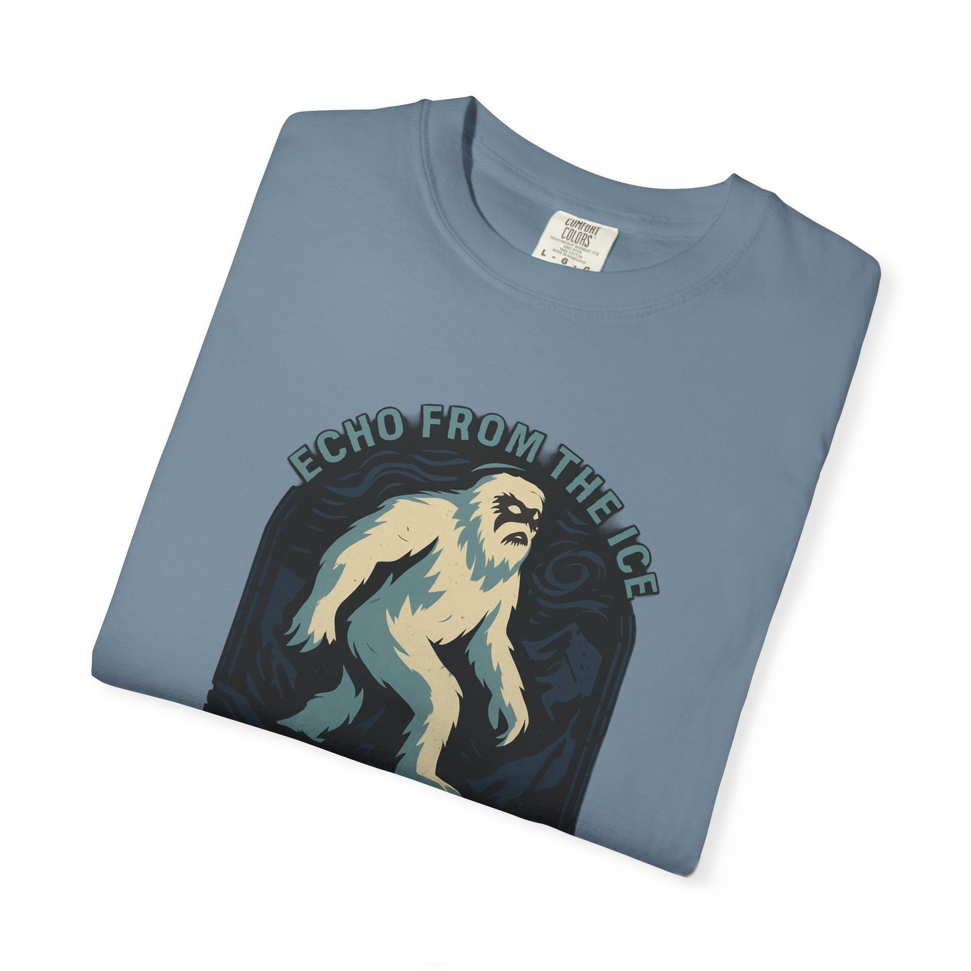 Folded blue t-shirt with a graphic of a creature and 'Echo from the Ice' text on a white background