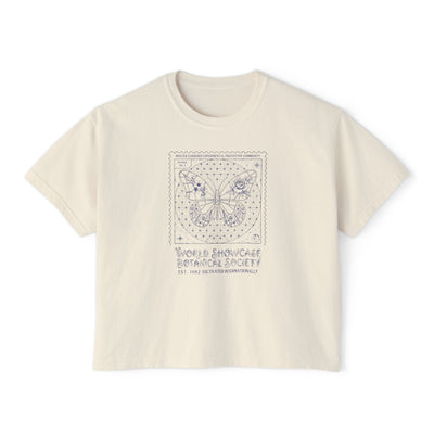 Beige t-shirt with butterfly design and text on a white background