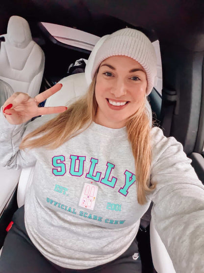 Woman in sully monsters Inc white sweatshirt 