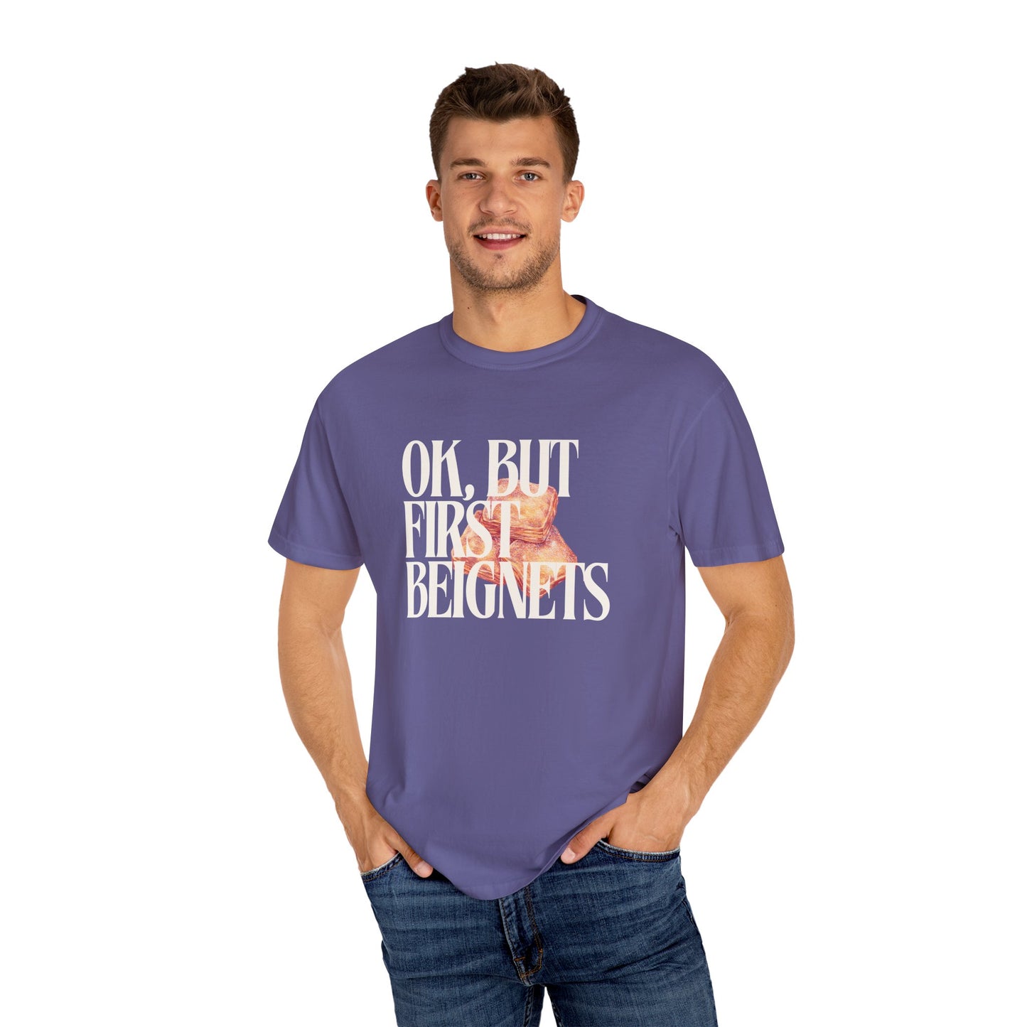 Man wearing a purple t-shirt with text and a graphic on a white background