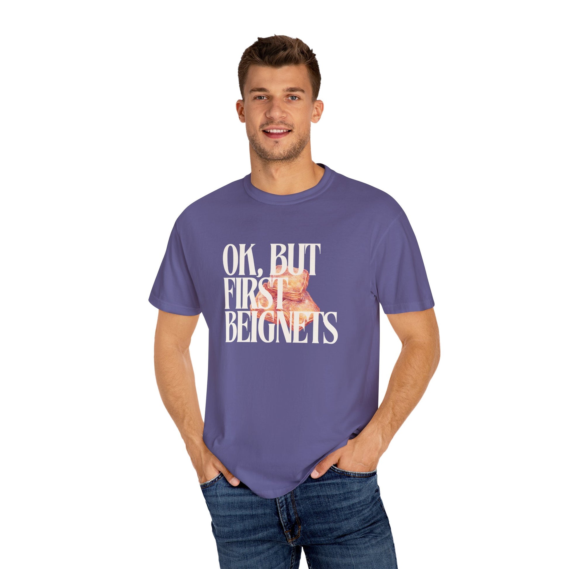 Man wearing a purple t-shirt with text and a graphic on a white background