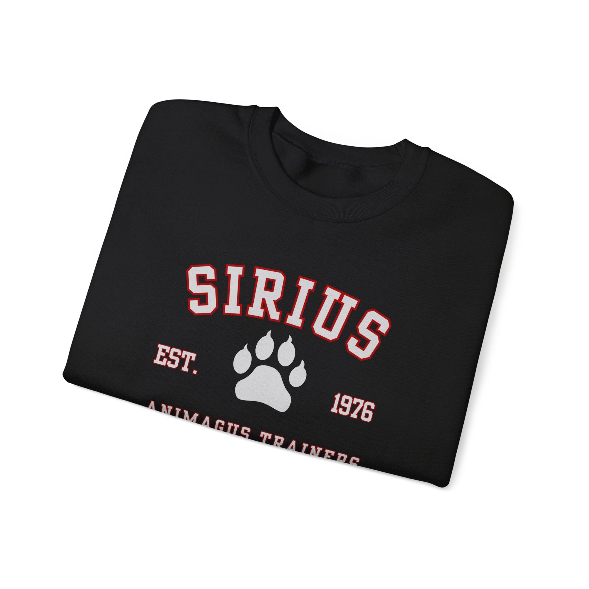 Folded black sweatshirt with 'SIRIUS' text and paw print design on a white background