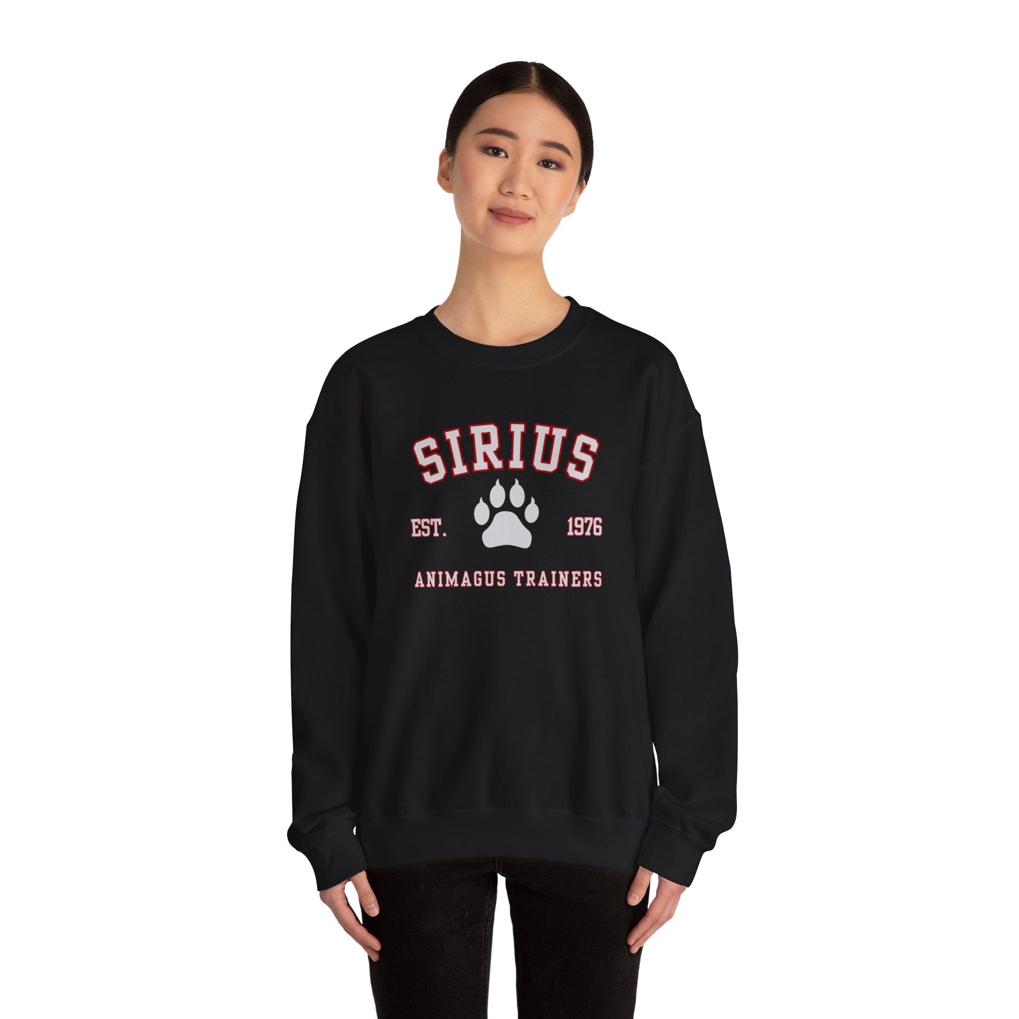 Person wearing a black sweatshirt with 'SIRIUS' and paw print design on a white background