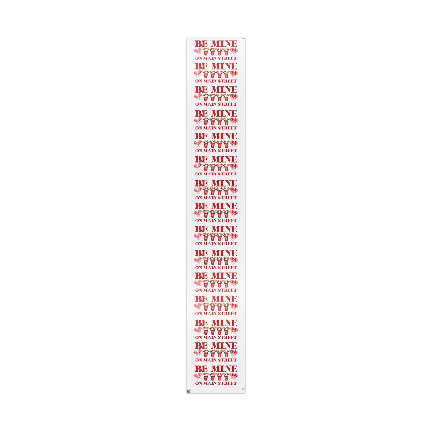 Roll of red and white paper with 'Be Mine' text on a white background