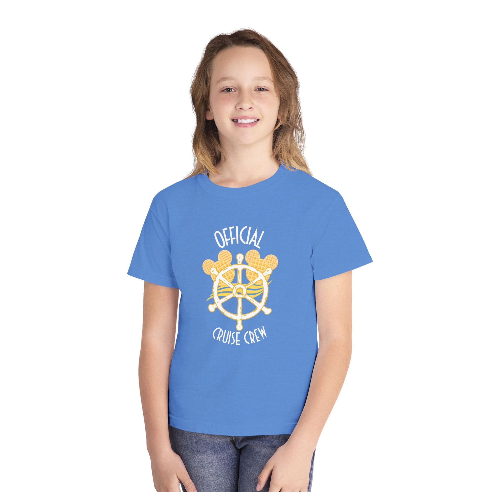 Child wearing a blue t-shirt with a yellow ship wheel design and text on a white background