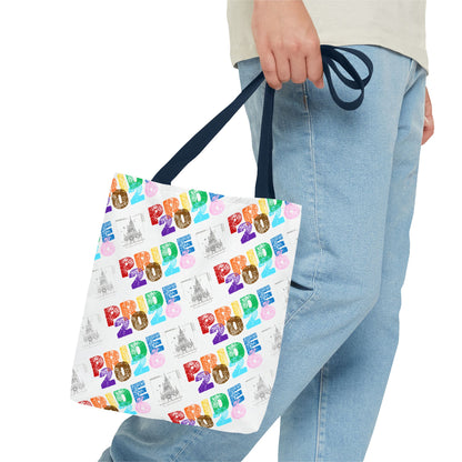 Tote bag with 'Pride 2026' text held by a person wearing jeans.