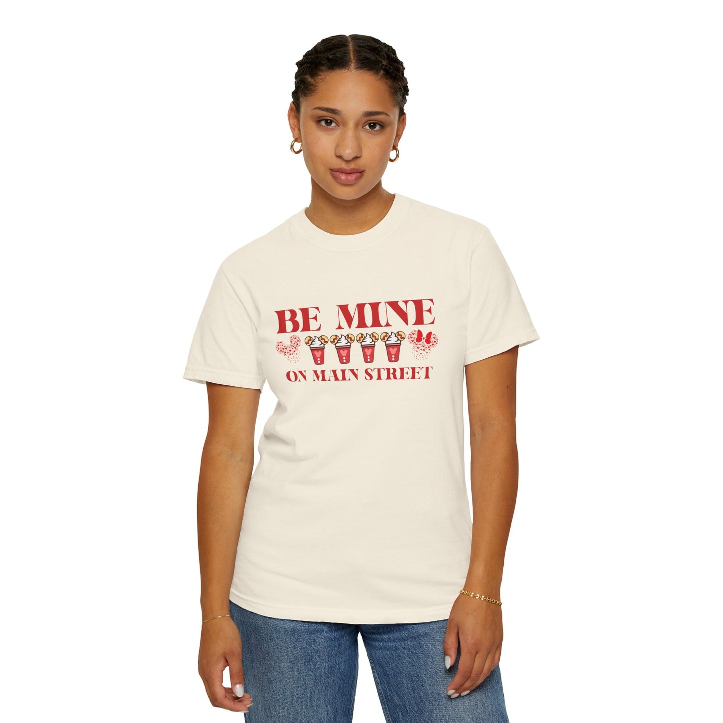 Person wearing a white t-shirt with red text and graphics on a white background