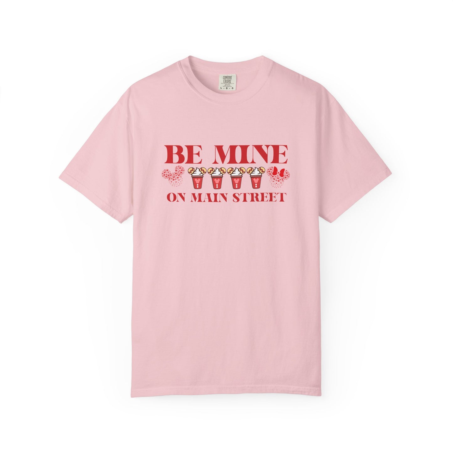 Pink t-shirt with 'Be Mine on Main Street' text and graphics on a white background