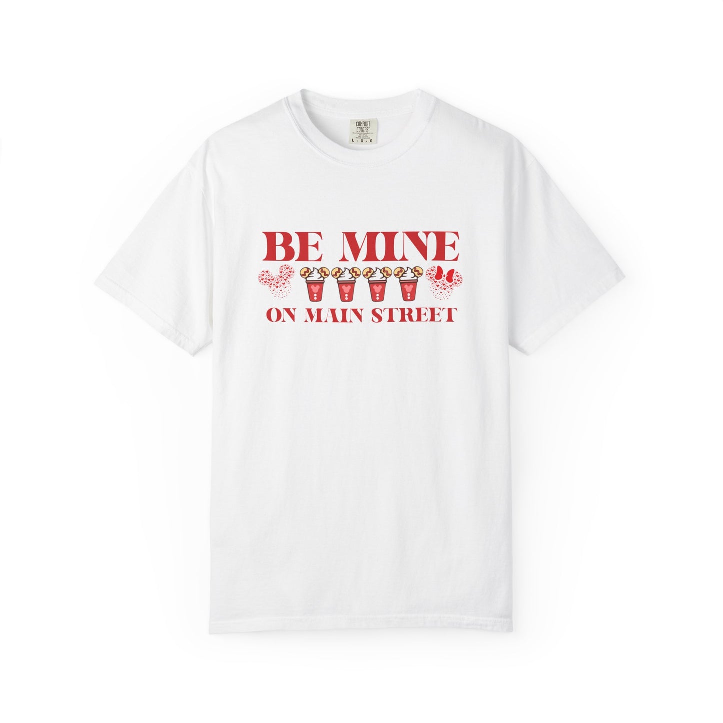 White t-shirt with red text 'BE MINE ON MAIN STREET' on a white background