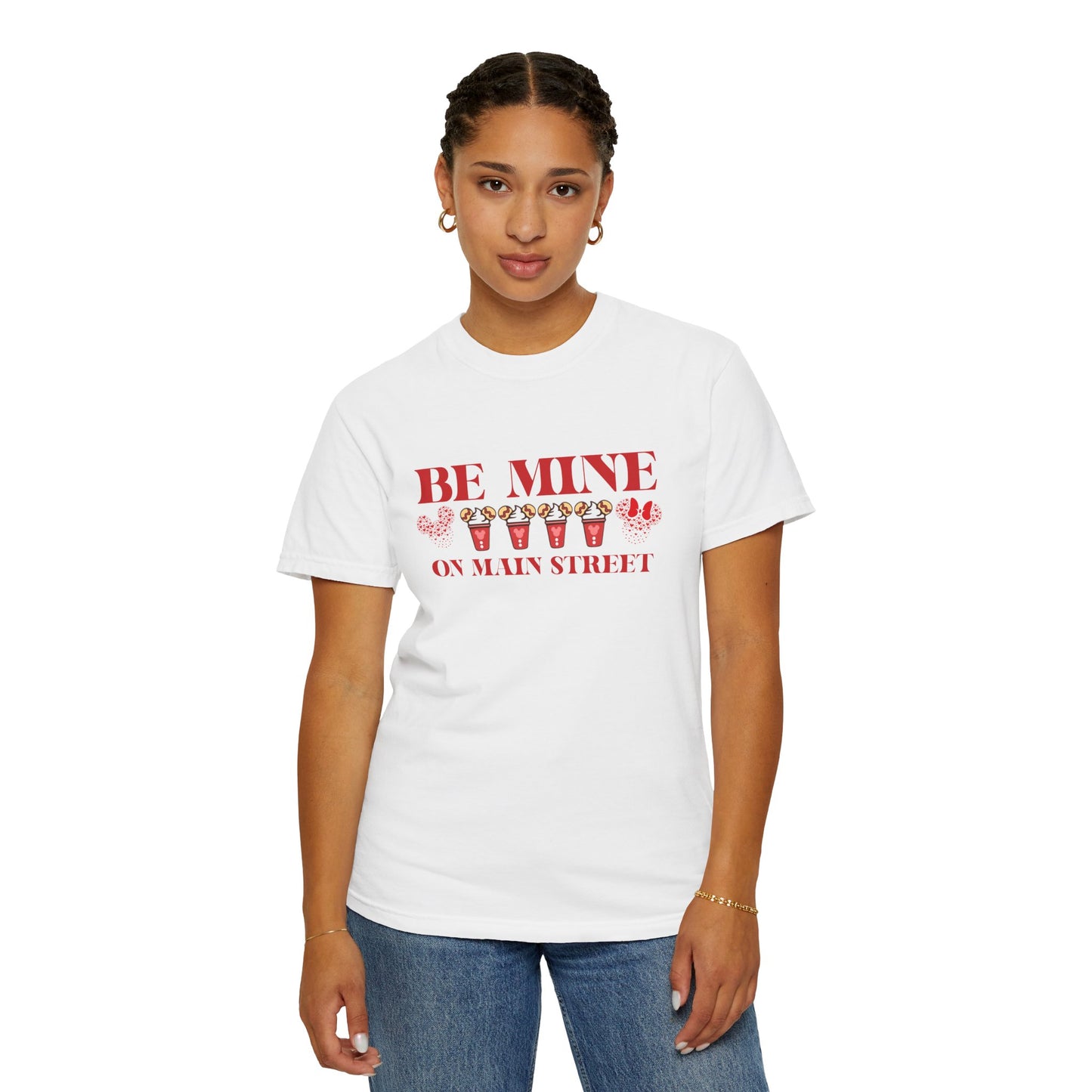 Person wearing a white t-shirt with red text and graphics on a white background