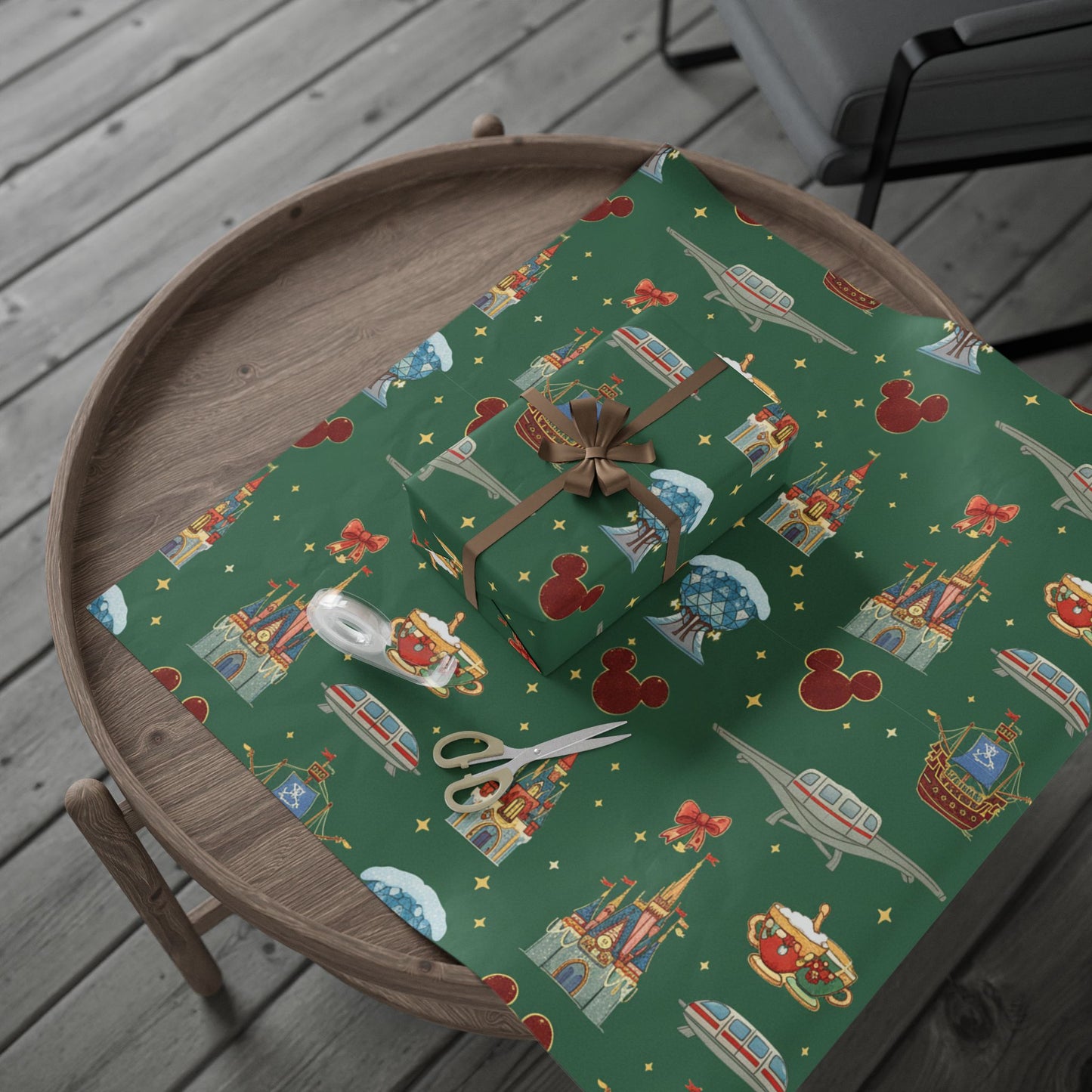 Gift box on a green patterned surface with a wooden tray underneath