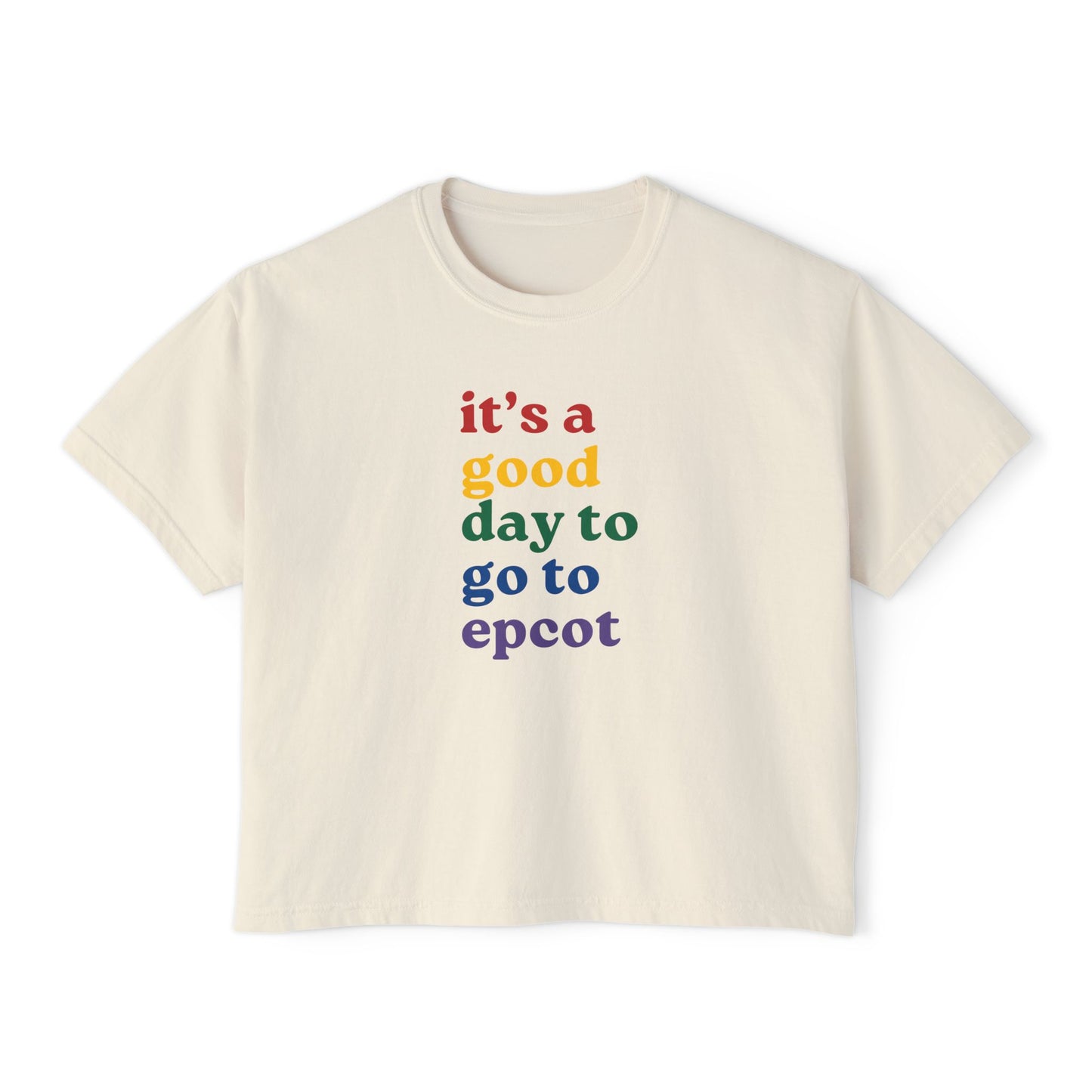 Beige t-shirt with colorful text 'it's a good day to go to epcot' on a white background