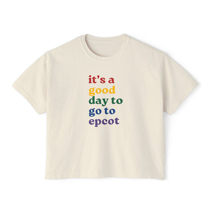 Beige t-shirt with colorful text 'it's a good day to go to epcot' on a white background