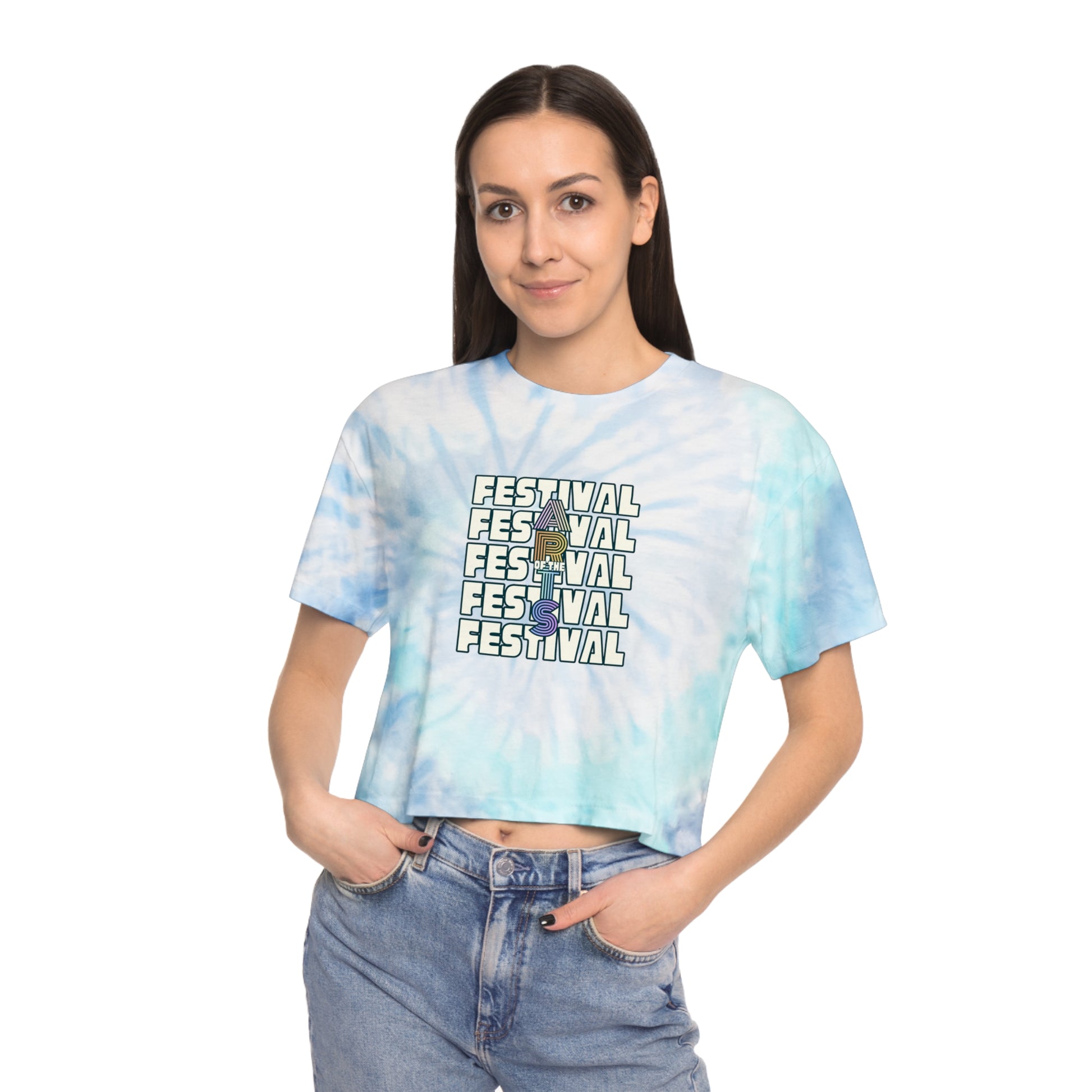 Person wearing a tie-dye crop top with 'Festival' text and denim shorts on a white background
