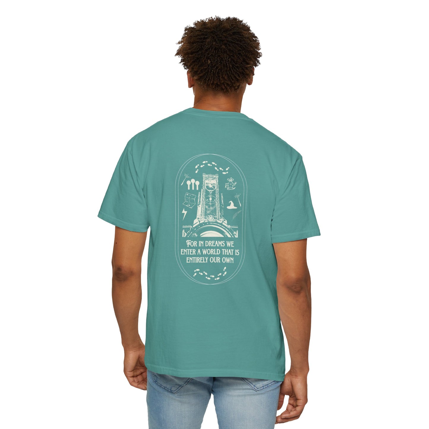 Person wearing a teal t-shirt with a graphic design on the back, standing against a white background