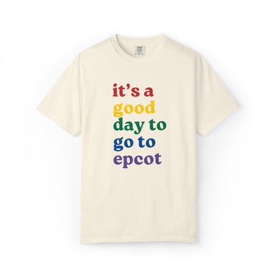 Beige t-shirt with colorful text 'it's a good day to go to epcot' on a white background
