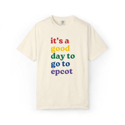 Beige t-shirt with colorful text 'it's a good day to go to epcot' on a white background