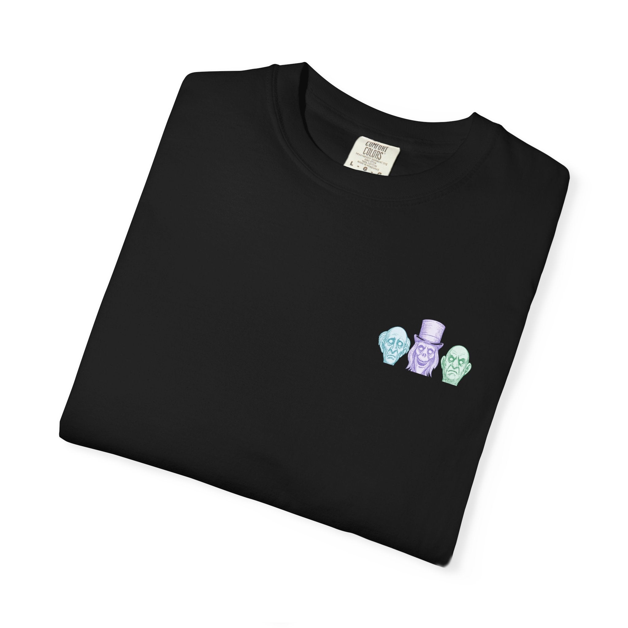 Folded black t-shirt with colorful embroidered designs on a white background