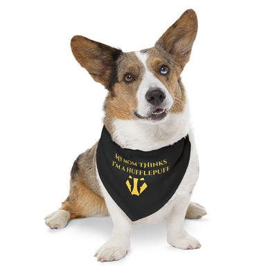 Dog wearing a hufflepuff black bandana with yellow text on a white background