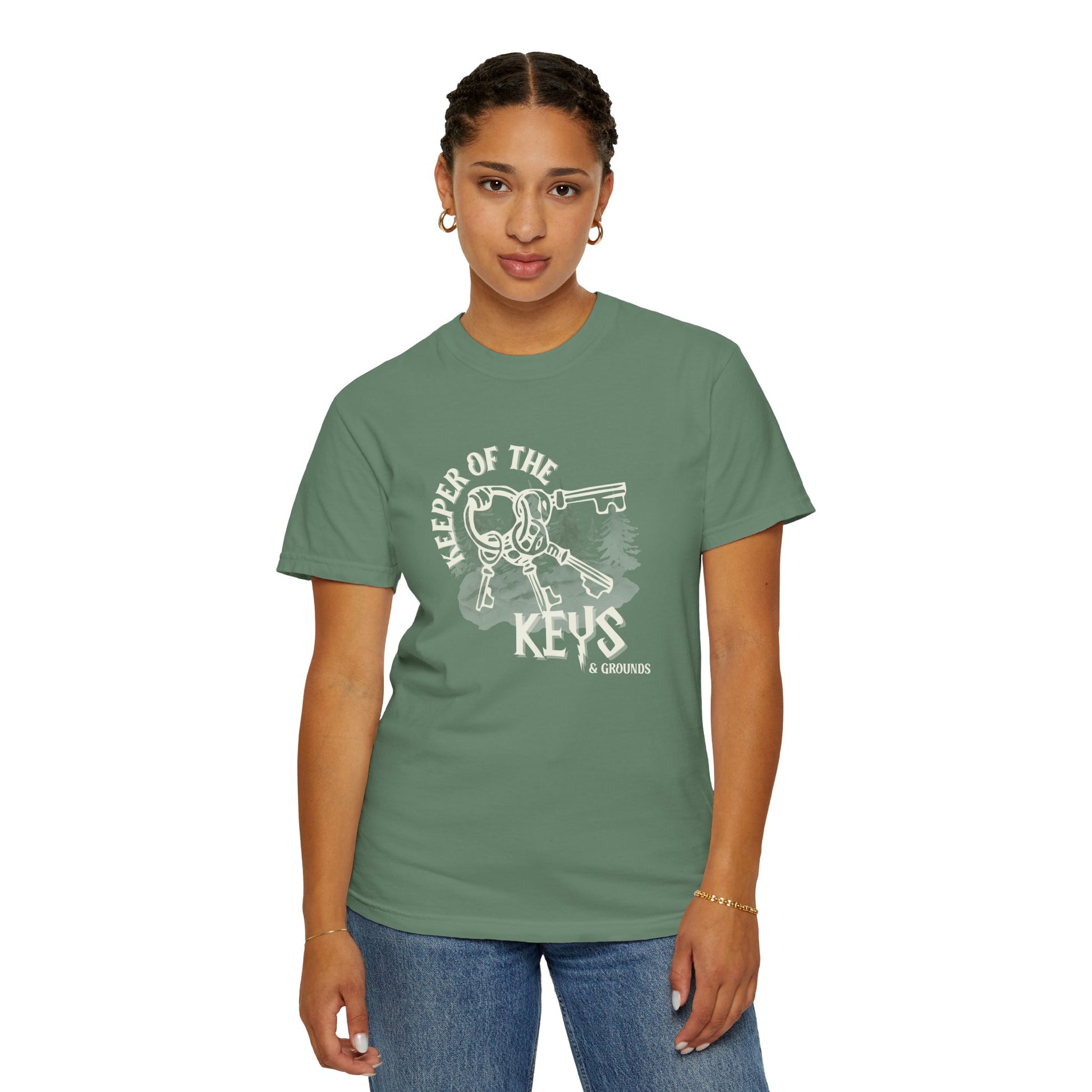 Person wearing a green t-shirt with a graphic design on a white background