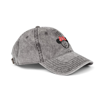 Gray baseball cap with a cartoon character design on a white background