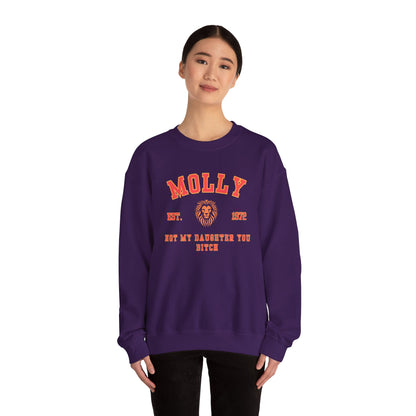 Person wearing a purple sweatshirt with red text and a lion graphic on a white background