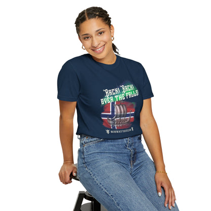 Person wearing a blue t-shirt with text and graphics, sitting on a stool against a white background