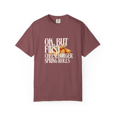 Maroon t-shirt with graphic and text on a white background