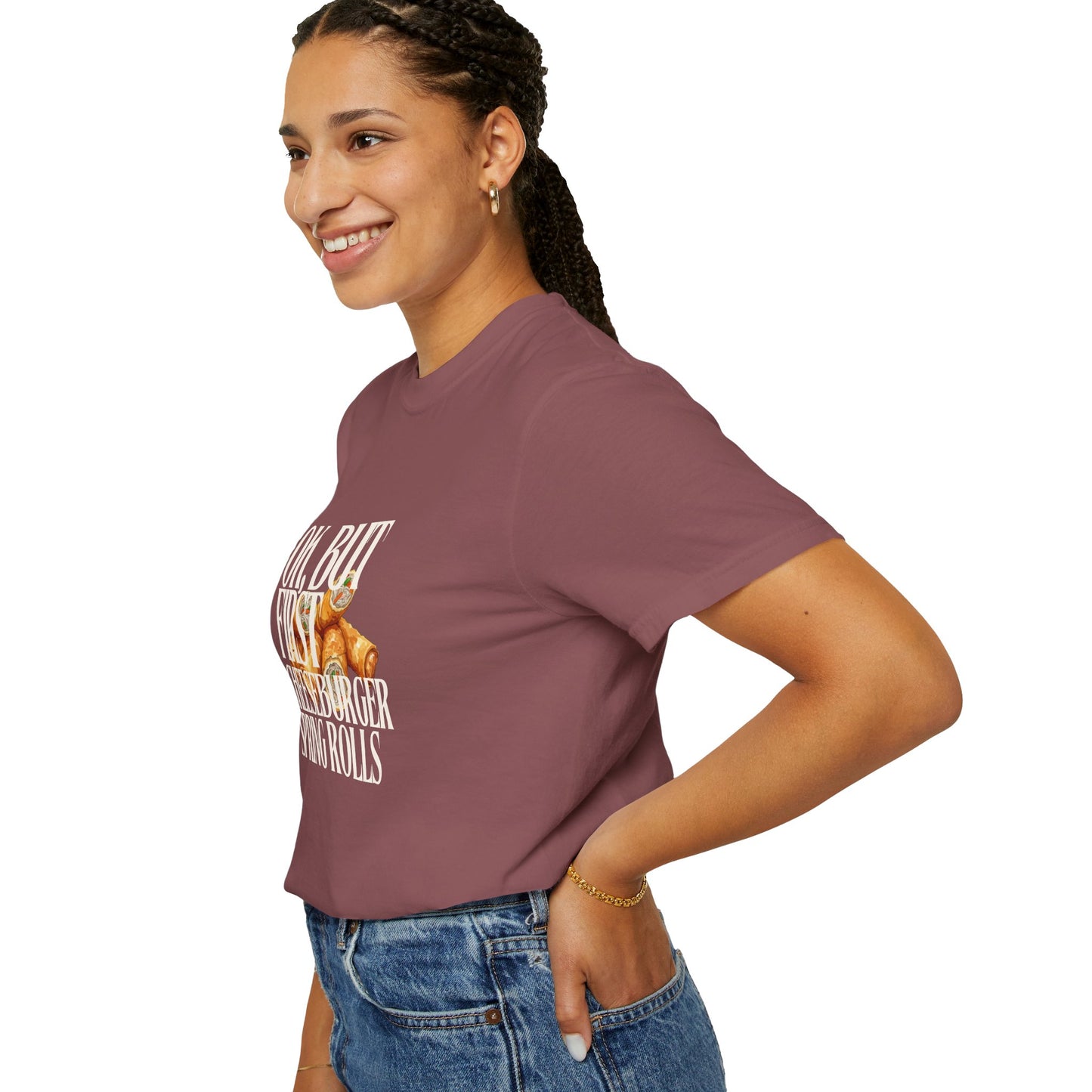 Woman wearing a mauve t-shirt with text and graphics on a white background