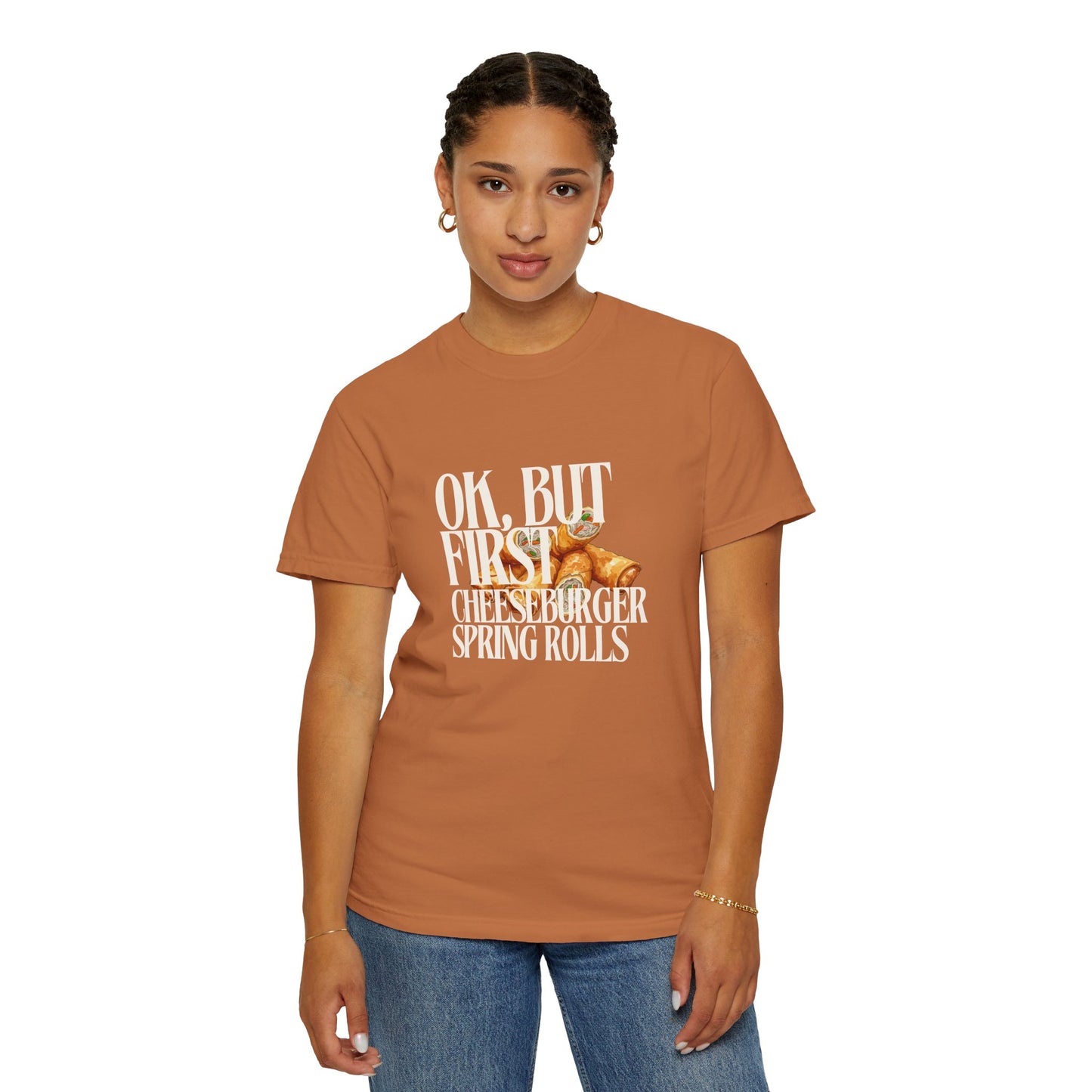 Person wearing a brown t-shirt with text and graphics on a white background