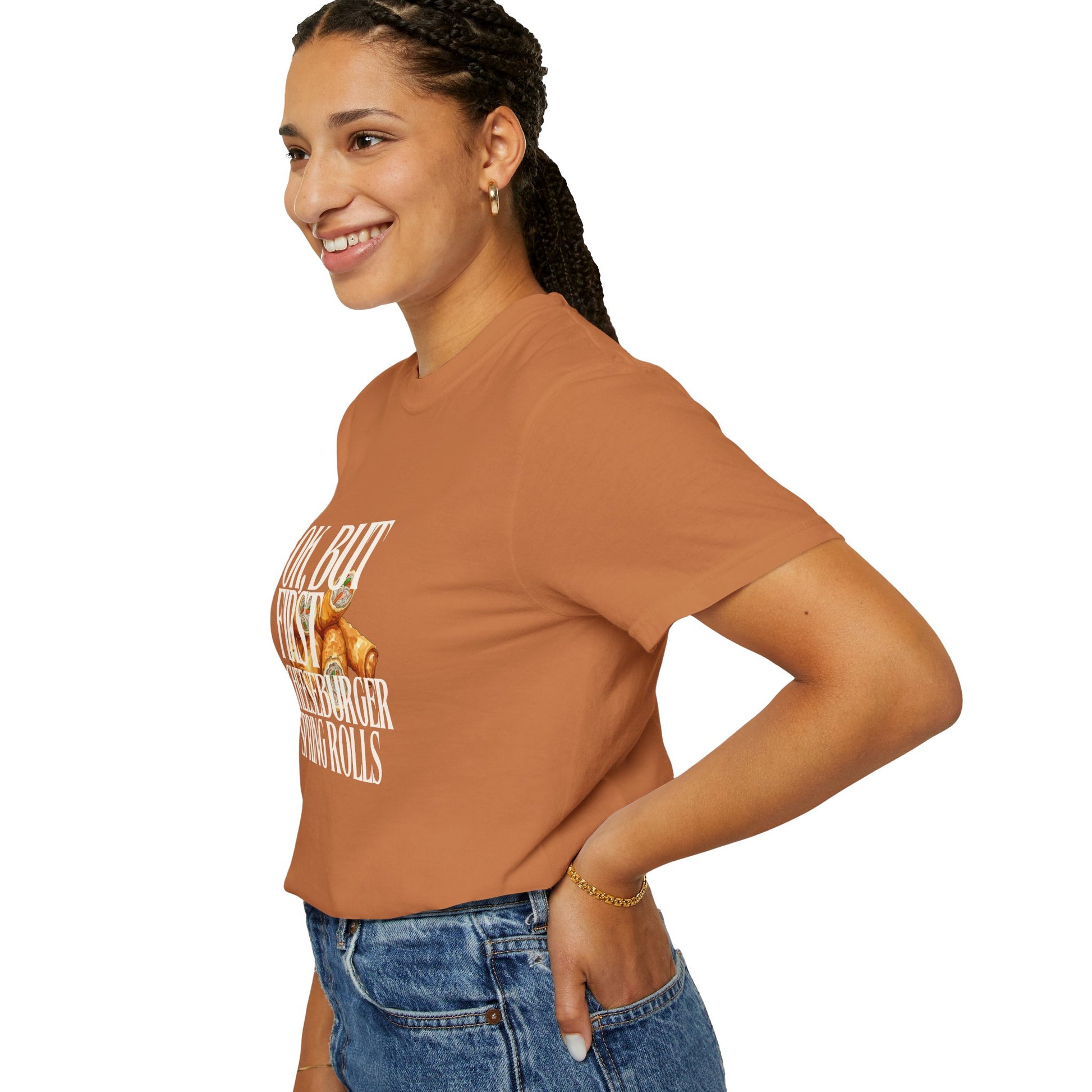Woman wearing a brown t-shirt with text and graphics on a white background