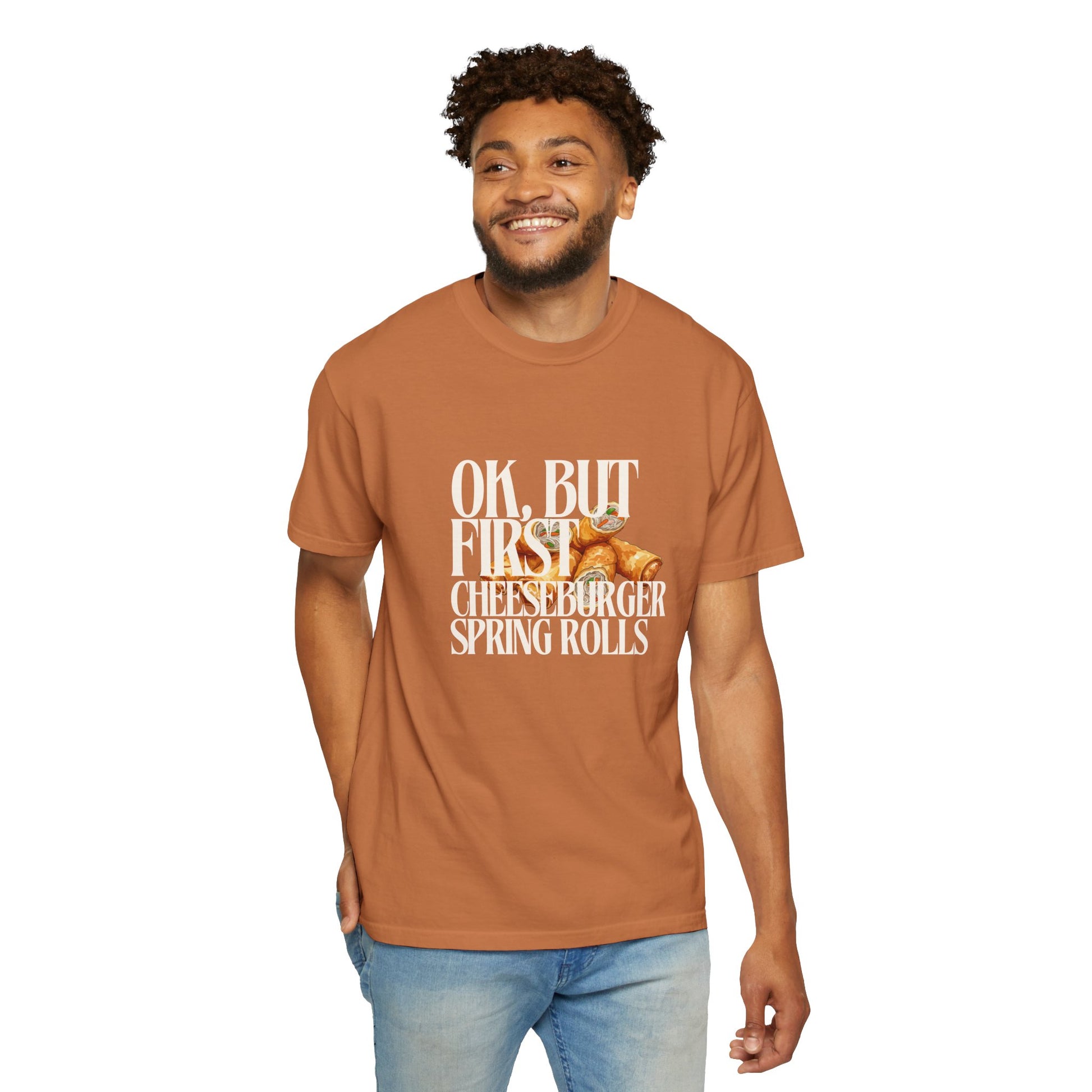 Man wearing a brown t-shirt with a humorous graphic and text on a white background
