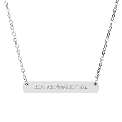 Silver necklace with 'ROPE DROP ROYALTY' pendant on a white background
