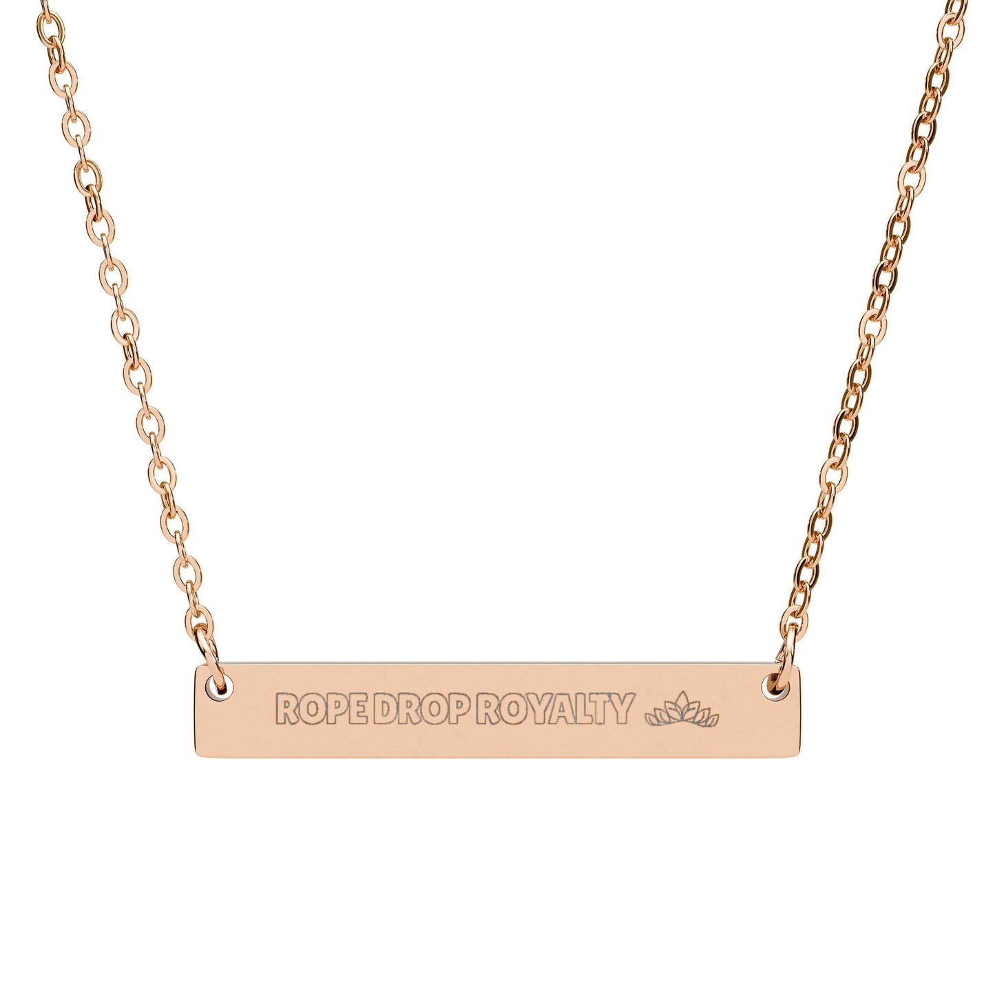 Rose gold necklace with 'ROPE DROP ROYALTY' engraving on a white background