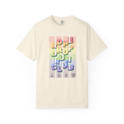 Beige t-shirt with colorful 'Rope Drop Fun Club' graphic on a white background