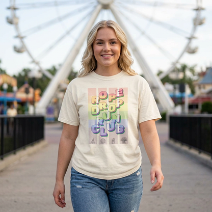 Woman wearing a t-shirt with colorful text in front of a Ferris wheel.