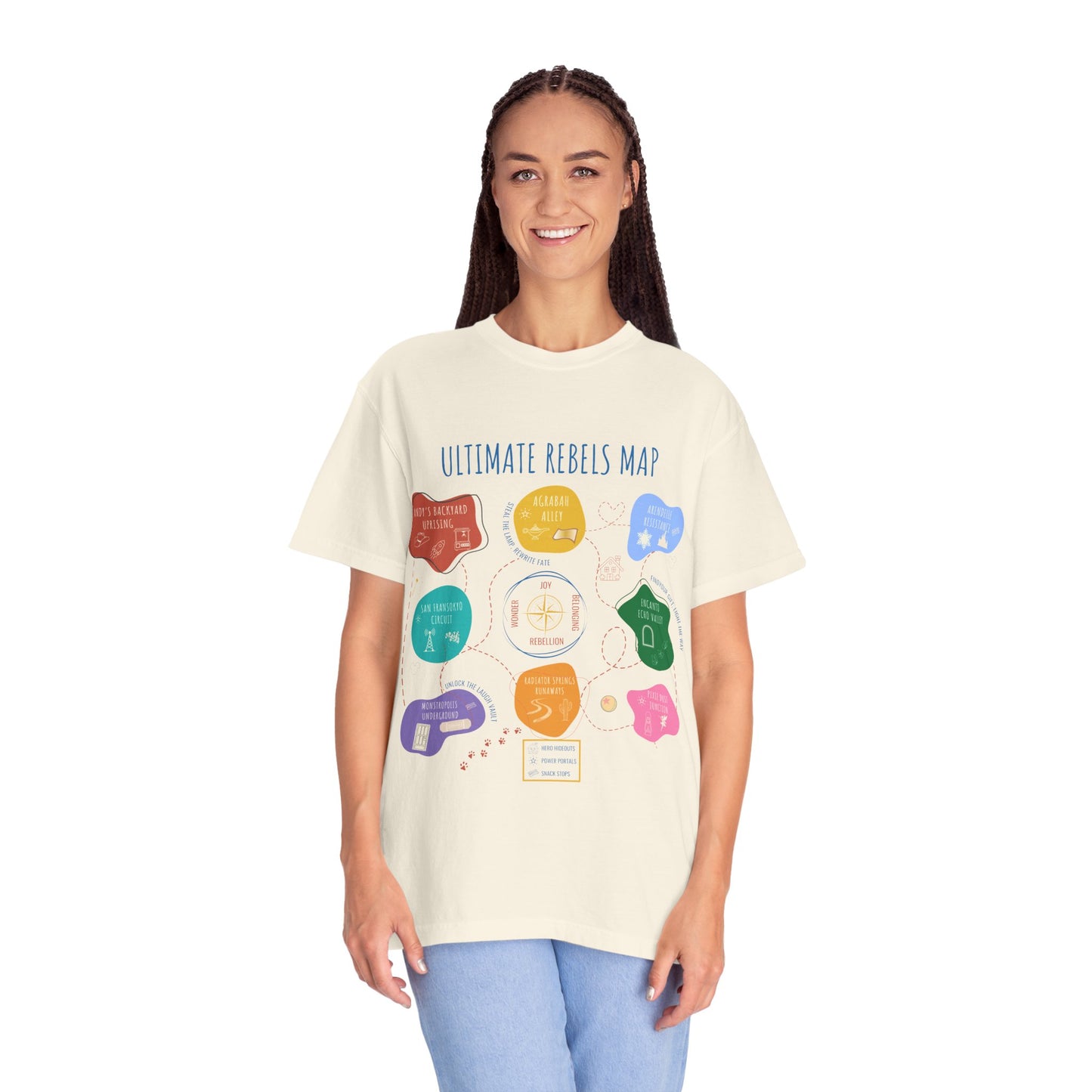 Person wearing a cream t-shirt with colorful graphics and text on a white background